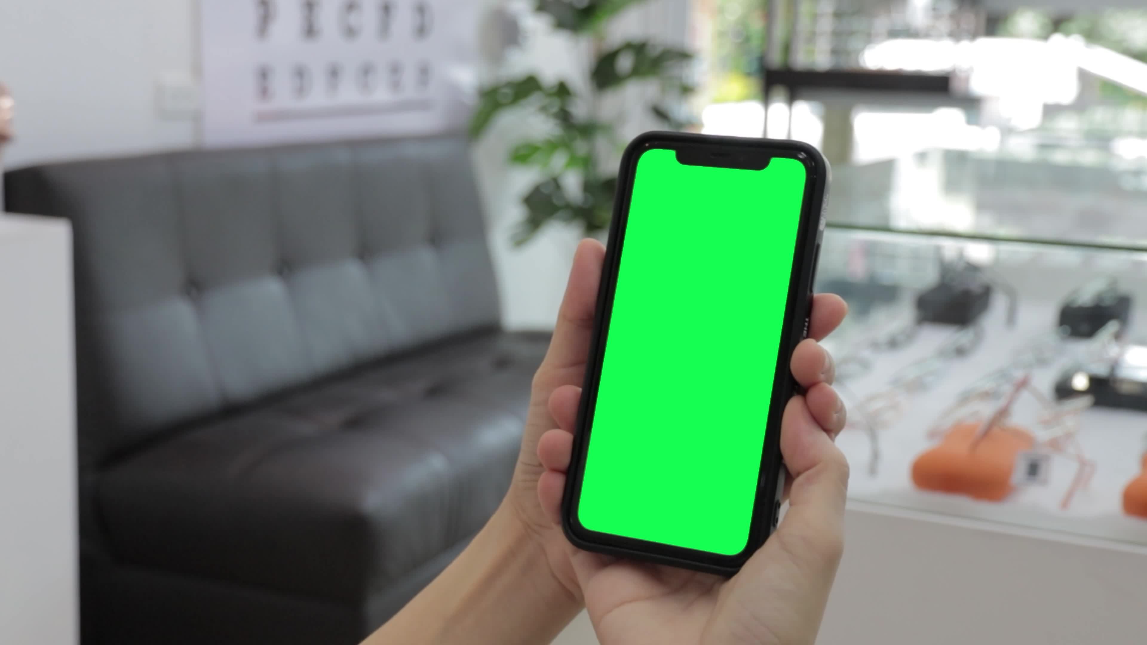 Green screen, smartphone green screen in hand, Use green screen for