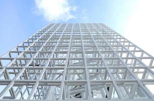 White Steel beam construction with blue sky background photo