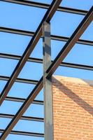 The construction of steel frame, roof, house, office building, shelter to prevent sun and rain by skilled technicians and closely supervised engineers. photo