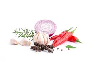 Composition of various herbs and spices vegetables rosemary pepper onion, garlic, fresh red chili, and garden mix for healthy food. isolated on white background, top view photo