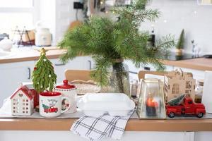 Food delivery service containers on table in white kitchen, festively served for celebration of Christmas and new year.  Saving time, hot order, disposable plastic box, craft package. mock up photo