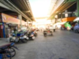 Blurred image. Wholesale market. Motorcycles parked in the morning. photo