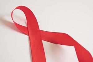 Red ribbon on a gray background, December 1 world AIDS day