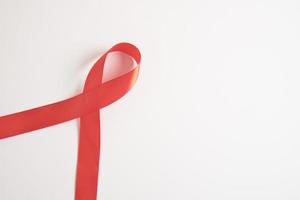 Red ribbon on a gray background, December 1 world AIDS day