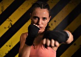 MMA woman fighter tough chick boxer punch pose pretty exercise training cross fit athlete photo