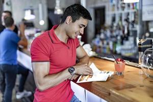 Man reading a book during coffee break photo