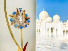 Abu dhabi, UAE, 2022 - close up flowers on columns art exterior details on Grand mosque. Corridors of Grand mosque with nobody in bright sun light photo