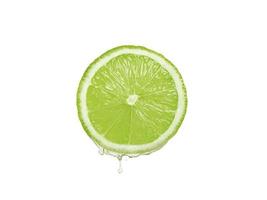 Lemon juice dripping from fruit on white background photo