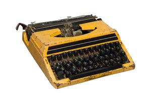 Rusty old vintage yellow typewriter isolated. photo