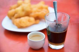 raditional coffee with Chinese breadstick. photo