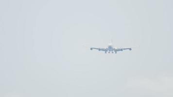 Airplane approaching before landing on the Phuket airport. View from the top floor of the hotel Centara Grand West Sands Resort Phuket video