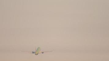 Rear view, the plane is gaining altitude and flying away. Tracking shot of airplane climbing in sky after takeoff video