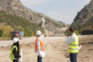 construction workers controlling explosion photo