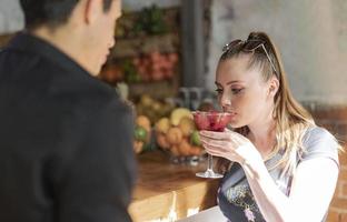 love couple sitting in the coffee bar enjoying beautiful fall day photo