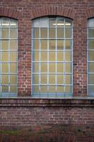 multi-piece window of an old brick industrial building photo