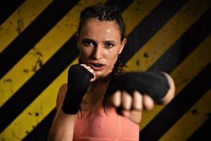 MMA woman fighter tough chick boxer punch pose pretty exercise training cross fit athlete photo