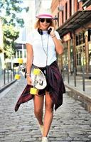 cool skateboard woman at a public graffiti park photo