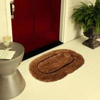 Designer Welcome Entry Doormat Placed on Floor Outside Entry Door with Plants and lemon ice drink photo