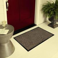 Designer Welcome Entry Doormat Placed on Floor Outside Entry Door with Plants and lemon ice drink photo