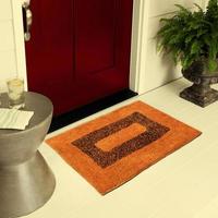 Designer Welcome Entry Doormat Placed on Floor Outside Entry Door with Plants and lemon ice drink photo