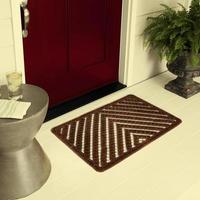 Designer Welcome Entry Doormat Placed on Floor Outside Entry Door with Plants and lemon ice drink photo