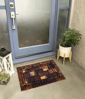 Designer Welcome Entry Doormat Placed Outside Entry Door with Plant and Lamp photo