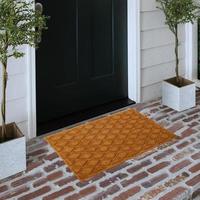 Designer Welcome Entry Doormat Placed on Solid Brick Floor Outside Entry Door with Plants photo