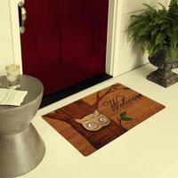 Designer Welcome Entry Doormat Placed on Floor Outside Entry Door with Plants and lemon ice drink photo