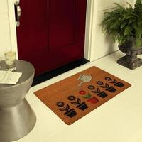 Designer Welcome Entry Doormat Placed on Floor Outside Entry Door with Plants and lemon ice drink photo