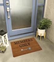 Designer Welcome Entry Doormat Placed Outside Entry Door with Plant and Lamp photo