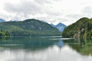 Reflection of Alpsee Lake view during Summer in Bavaria, Germany holiday photo