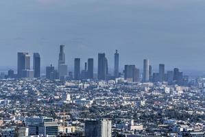 Downtown Los Angeles skyline over blue cloudy sky in California from Hollywood Hills. photo