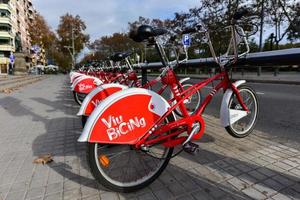 Barcelona, Spain - November 29, 2016 -  Iconic bicycles of the Bicing service in Barcelona, Spain. With the bicing sharing service people can rent bicycles for short trips. photo