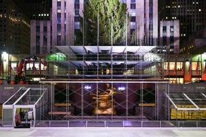 New York, NY - Nov 14, 2020 -  Real estate firm Tishman Speyer fitted masks on Prometheus and other classic statues in Rockefeller Center to encourage New Yorkers to wear COVID-19 face coverings. photo