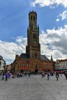 Bruges, Belgium - May 12, 2017 -  Belfry Tower in the historical center of Bruges, Belgium. photo