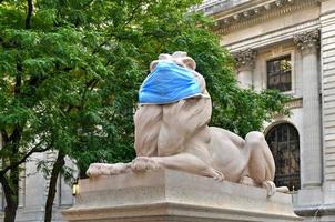 New York, NY, USA - July 2, 2020 -  The New York Public Library's stone lions Patience and Fortitude have donned face masks to remind New Yorkers to wear face coverings during the COVID-19 pandemic. photo