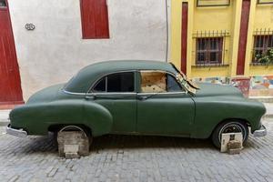 Classic Car under repair in the streets of Old Havana, Cuba, 2022 photo