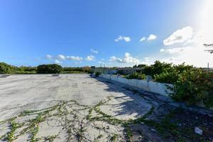 Old abandoned pool in Alamar, a district in the eastern part of Havana in Cuba. This district is primarily prefabrication construction of Soviet-style architecture. photo