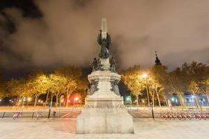 Francesc de Paula Rius i Taulet statue at Lluis Companys Promenade in Barcelona, Spain at night. photo