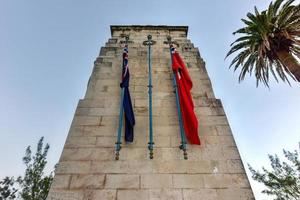 The Bermuda Cenotaph  located outside the Cabinet Building of Bermuda, in Hamilton. The Cenotaph is a memorial for those who died for Bermuda during the World War I and World War II. photo