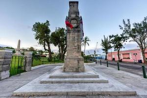 The Bermuda Cenotaph  located outside the Cabinet Building of Bermuda, in Hamilton. The Cenotaph is a memorial for those who died for Bermuda during the World War I and World War II. photo