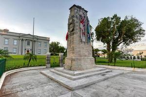 The Bermuda Cenotaph  located outside the Cabinet Building of Bermuda, in Hamilton. The Cenotaph is a memorial for those who died for Bermuda during the World War I and World War II. photo