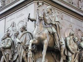 Base of the equestrian statue of Frederick the Great is an outdoor sculpture in cast bronze at the east end of Unter den Linden in Berlin, honouring King Frederick II of Prussia. photo