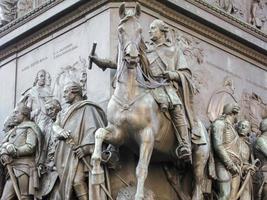 Base of the equestrian statue of Frederick the Great is an outdoor sculpture in cast bronze at the east end of Unter den Linden in Berlin, honouring King Frederick II of Prussia. photo