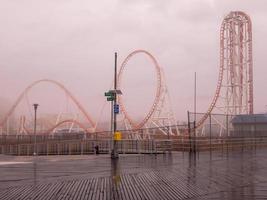 Brooklyn, New York - February 11, 2018 -  Thunderbolt Rollercoaster in Coney Island, Brooklyn on a foggy day. photo