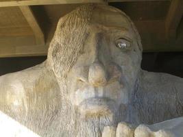 Seattle, Washington - August 21, 2005 -  Fremont Troll crushes a Volkswagen Beetle under the Aurora Bridge, Washington photo