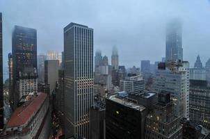 Aerial View of the skyscrapers of downtown Manhattan in New York City in a foggy afternoon. photo