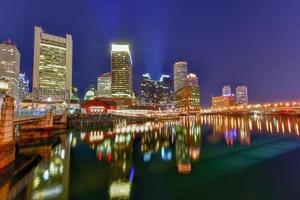 Boston Harbor in Massachusetts, USA with its mix of modern and historic architecture at night. photo