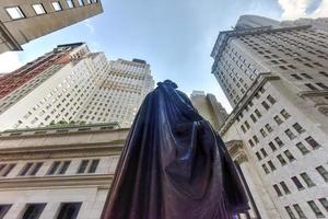 Federal Hall with Washington Statue from behind on Wall Street in Manhattan, New York City. Location where George Washington took the oath of office as first President. photo