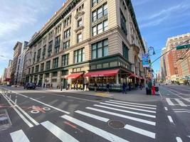 New York City - Apr 7, 2020 -  Social distancing as people lines up to enter a supermarket during the Coronavirus epidemic in New York City. photo